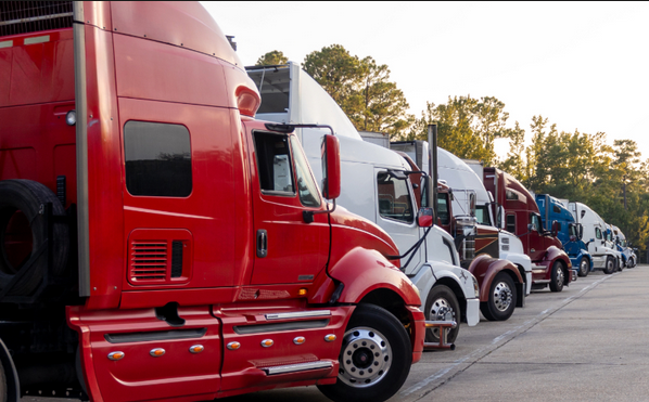 Fleet of commercial trucks lined up showcasing modern technology driven logistics and efficient freight operations